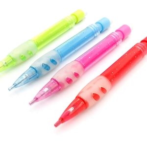 Detailed view of colorful glitter mechanical pencils with ergonomic soft rubber grips