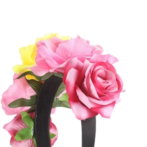 Halloween Mexican party headband featuring large pink and yellow fabric rose flowers