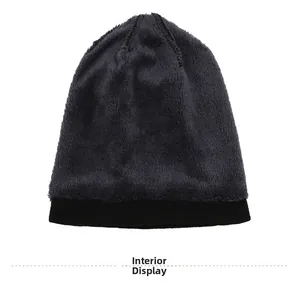 Detail view of the warm gray plush lining inside the knitted winter beanie hat