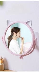 Detail view of pink cat ear wall-mounted vanity mirror with adjustable rotating function
