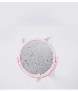 Close-up of pink cat-ear makeup mirror with waterproof water droplets and suction cup mount
