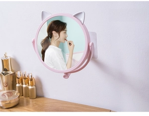 Pink cat-ear makeup mirror with rotatable wall-mount bracket for space-saving vanity use