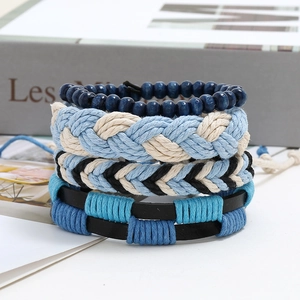Detail of 4-piece stackable bracelet set with blue wood beads and woven hemp rope