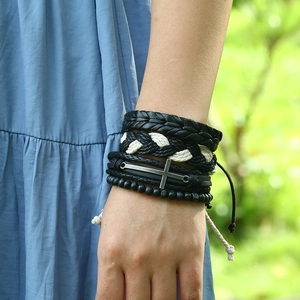 Men's multilayer leather bracelet set with wooden beads and metal cross on model wrist