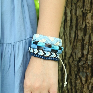 Four-piece punk braided bracelet set with leather cords and blue wooden beads