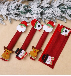 Detail of four Christmas appliance handle covers with festive 3D Santa and elk figures