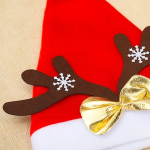 Cappello di Natale in velluto rosso con corna di renna marroni e fiocco di raso d'oro