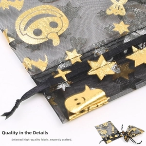 Detail of Halloween organza gift bag with gold foil pumpkins and black drawstring