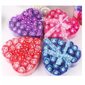 Set of four heart-shaped soap flower gift boxes in purple, pink, red, and blue with Love ribbon