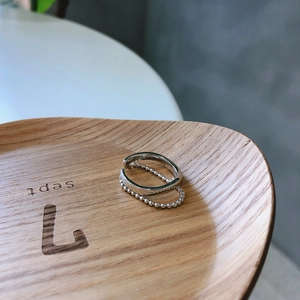 Close-up of double-layer S925 sterling silver ring with smooth band and bead chain detail