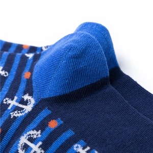 Detailed knit texture of nautical crew socks featuring anchor patterns and reinforced heels