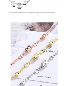 Detailed view of three-color bracelet set with crystal cylinders and link chain