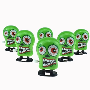 Set di sei giocattoli a carica a forma di testa di zombie verde con occhi spaventosi