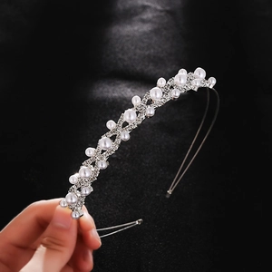 Elegant silver headband with layered pearls and sparkling rhinestones for bridal hairstyles