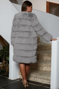 Back view of a long grey faux fur coat featuring a soft texture and oversized fit