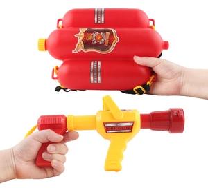 Detail of red firefighter backpack water tank and yellow squirt gun for kids beach play