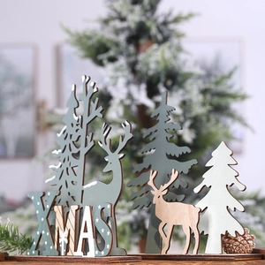 Detail of wooden XMAS letter sign with elk and Christmas tree desk ornaments