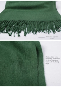 Detailed view of dark green scarf with 10cm fringe tassels and refined edge craftsmanship