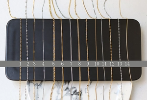 Selection of 14 gold and silver titanium steel chain necklace styles for layering