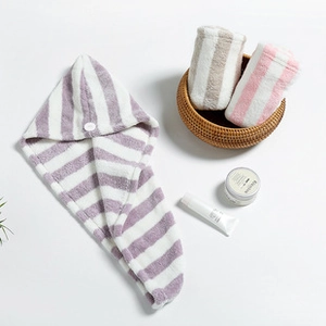 Detail of striped microfiber hair drying caps in soft purple and pink coral fleece