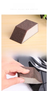 Kitchen scouring sponge with abrasive emery surface for removing rust from pots and pans