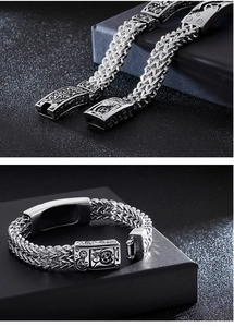 Detail view of vintage silver stainless steel men's bracelet with mechanical gear patterns
