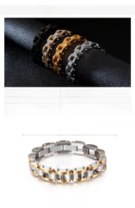Detail of 14mm wide two-tone stainless steel mechanical link bracelet with rivets