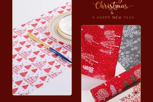 Close-up of festive Christmas table runner featuring red linen and snowflake patterns