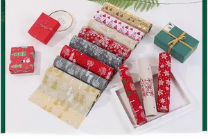 Detail of assorted Christmas linen ribbons featuring festive tree and snowflake prints
