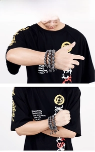 Detailed view of vintage Buddhist mantra prayer beads made of durable stainless steel