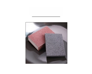 Macro detail of red and grey coarse emery sponges for kitchen rust and stain removal
