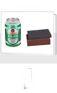 Macro detail of abrasive emery sponges in black and red showing size next to a soda can