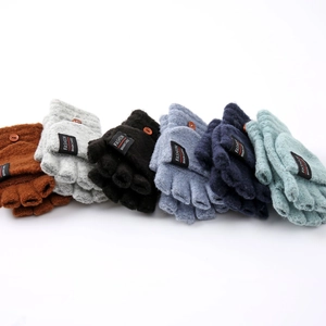 Detail of multi-color knitted convertible flip-top mittens with fashion button labels