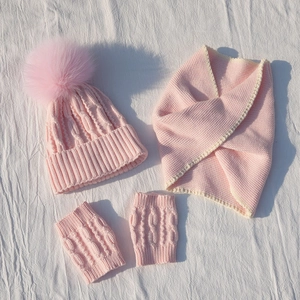 Pink knit set for kids featuring a pompom beanie, lace-trim scarf, and fingerless gloves