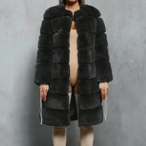 Detail of dark grey faux fur coat showing thick plush texture and horizontal seam design
