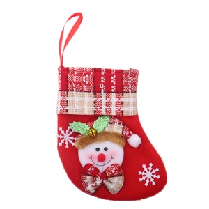 Detail of red Christmas stocking featuring 3D snowman, snowflake embroidery and bells