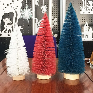 Detailed view of mini sisal bottle brush Christmas trees with colorful needles and wood base