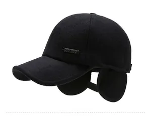 Detail of winter baseball cap with ear flaps and SPORT metal badge on side