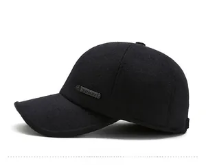 Detail view of winter baseball cap with warm wool fabric and metal Sport badge