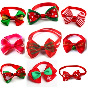 Collection of nine festive Christmas pet bow ties with diverse patterns and small golden bell