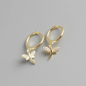 Close-up of S925 sterling silver dragonfly earrings with gold plating and sparkling crystals