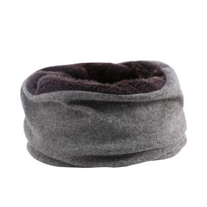Detail shot of the soft gray fleece exterior and brown warm lining of the winter snood