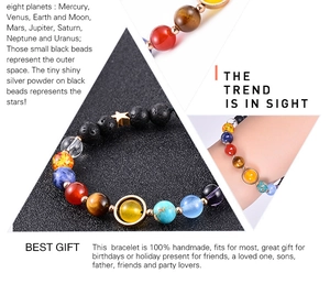 Detailed close-up of handmade 8mm solar system bracelet with lava rock and star charm