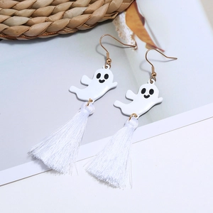 Close-up of white ghost earrings with tassel detail and gold metal ear hooks