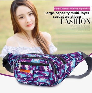 Detail view of multi-layer zipper storage and orange Sport label on camo waist bag