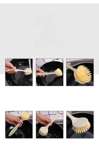Close-up of long-handled dish brush with hanging hole and dense yellow bristles