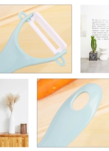 Detail view of a light blue ceramic peeler with white blade on a minimalist background