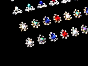 Macro detail of assorted bridal nail art alloy charms with K9 crystals in gold and silver