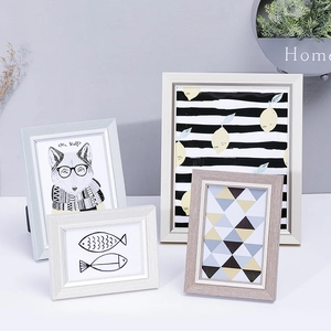 Nordic minimalist photo frame set in white, gray, and wood finish for tabletop display