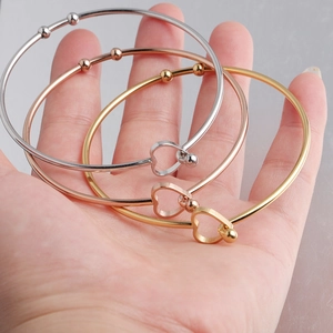 Three-piece stainless steel open heart bracelets in silver, gold, and rose gold finishes